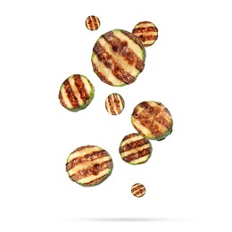 Image of Slices of grilled zucchinis in air on white background