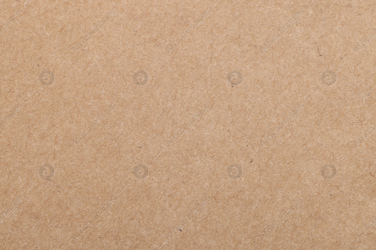 Photo of Texture of beige paper sheet as background, top view