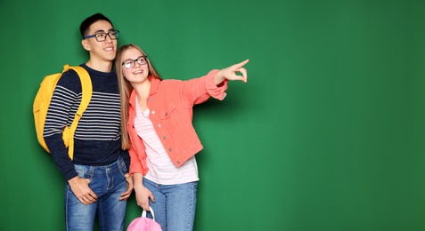 Photo of Cheerful teenagers on color background, space for text. Youth lifestyle and friendship
