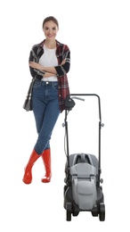 Young woman with modern lawn mower on white background