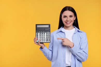 Smiling accountant with calculator on yellow background, space for text