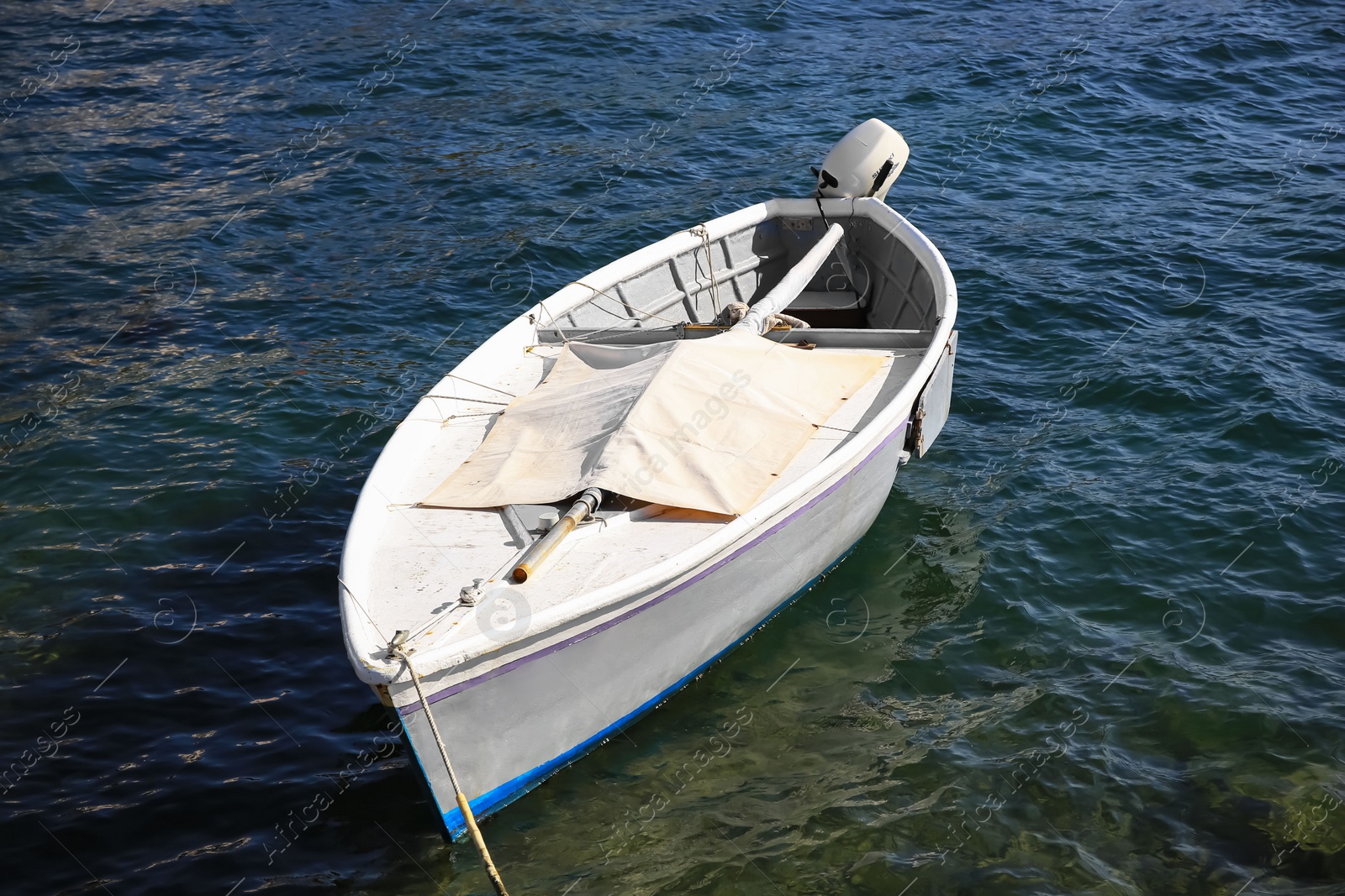 Photo of Beautiful view of sea with moored boat on sunny day