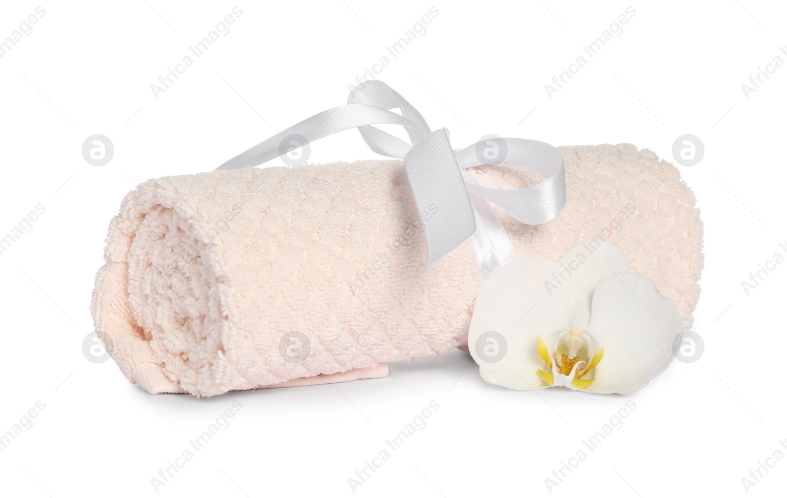 Photo of Clean soft towel tied with ribbon orchid isolated on white