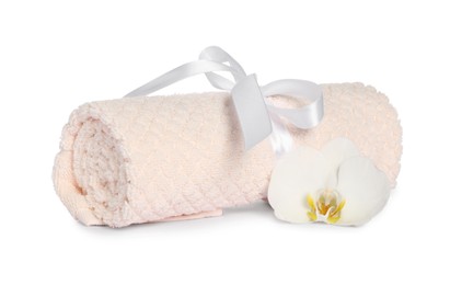 Photo of Clean soft towel tied with ribbon orchid isolated on white