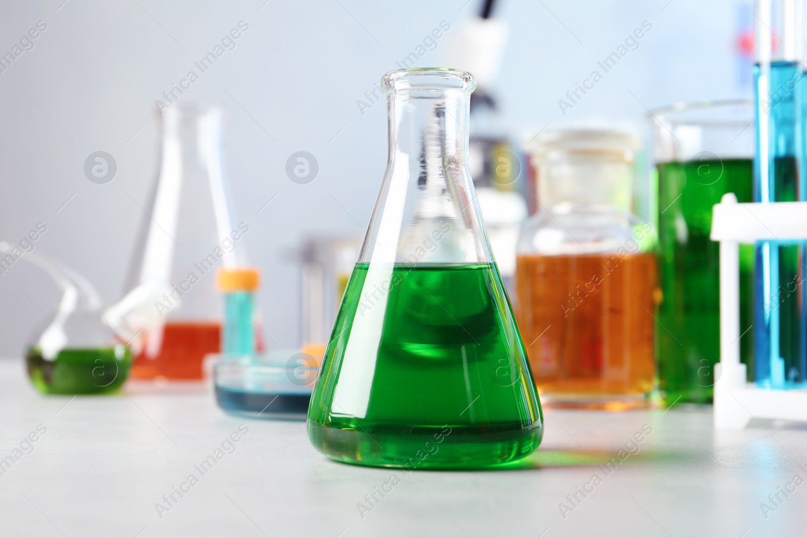 Photo of Conical flask and other glassware on table in chemistry laboratory