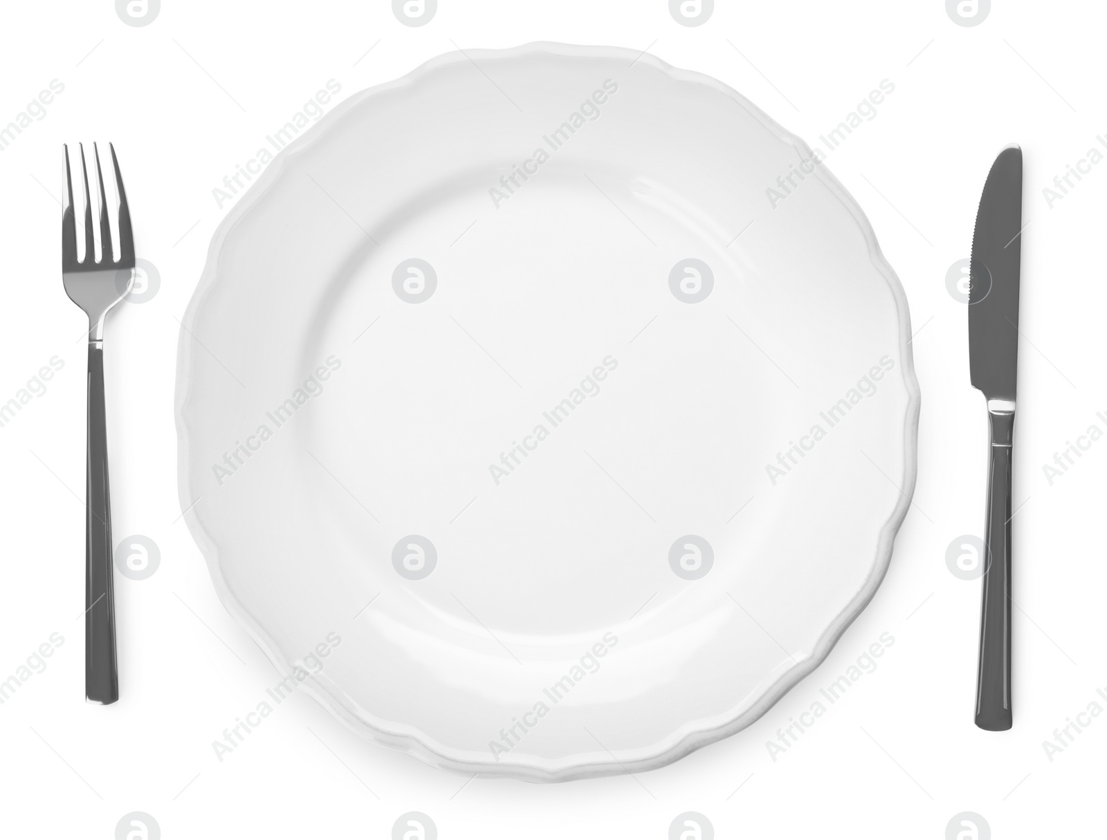 Photo of Plate and cutlery on white background, top view