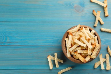 Delicious hard chucks on light blue wooden table, flat lay. Space for text