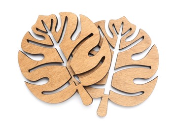 Leaf shaped wooden cup coasters on white background, top view