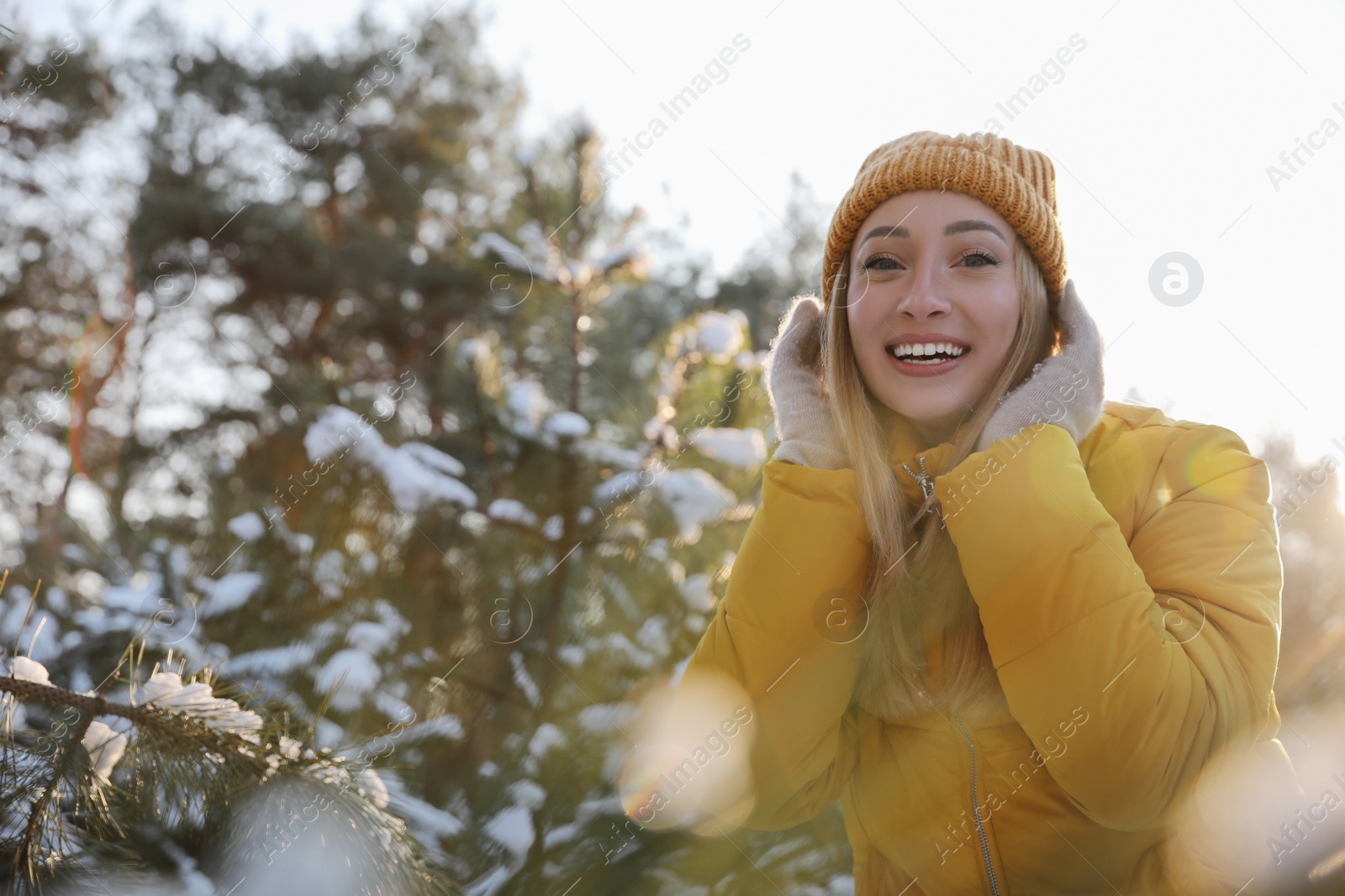 Photo of Woman enjoying winter day in forest, space for text