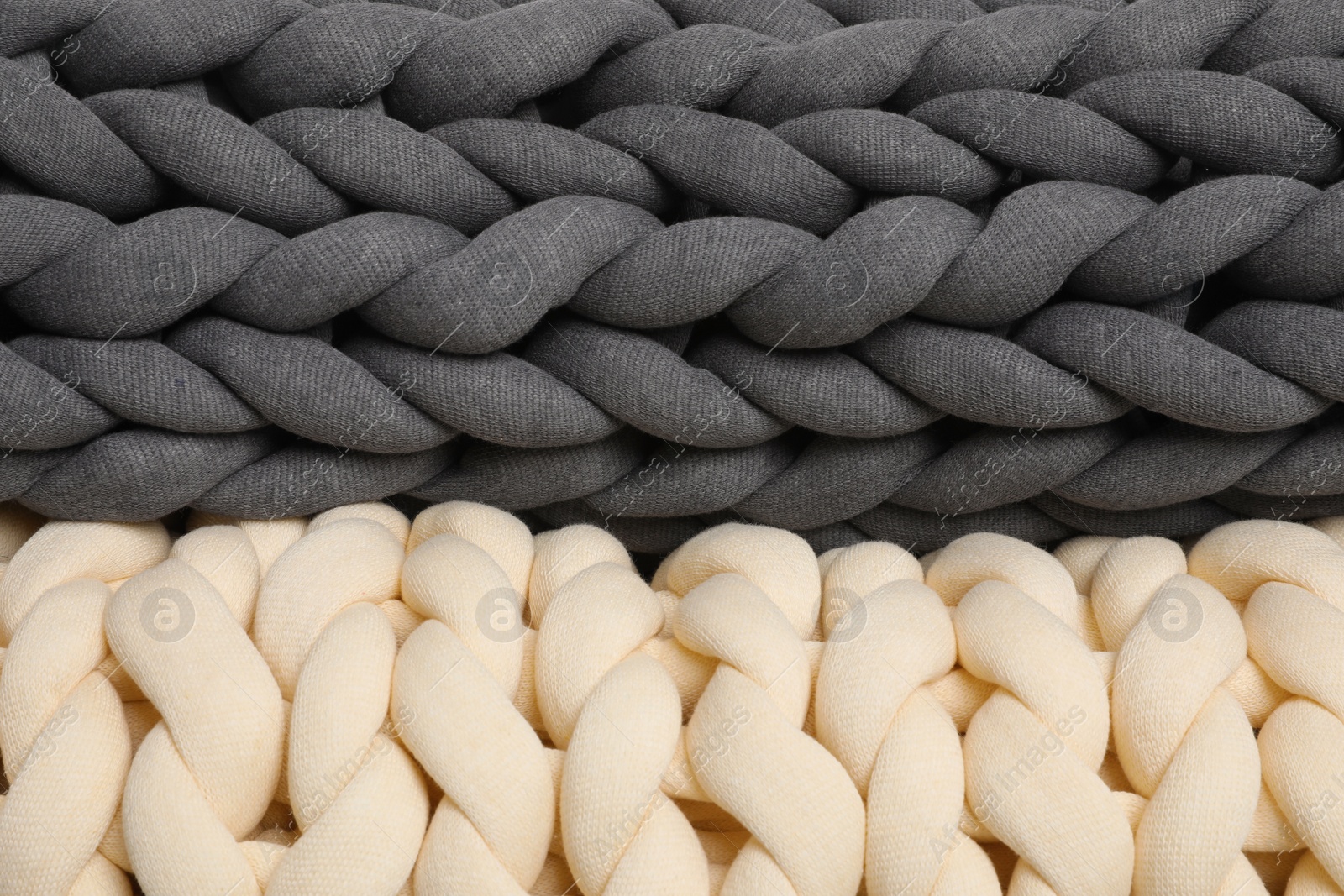 Photo of Chunky knit blankets as background, closeup view