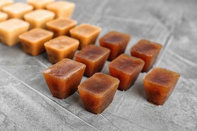 Photo of Composition with coffee ice cubes on grey table