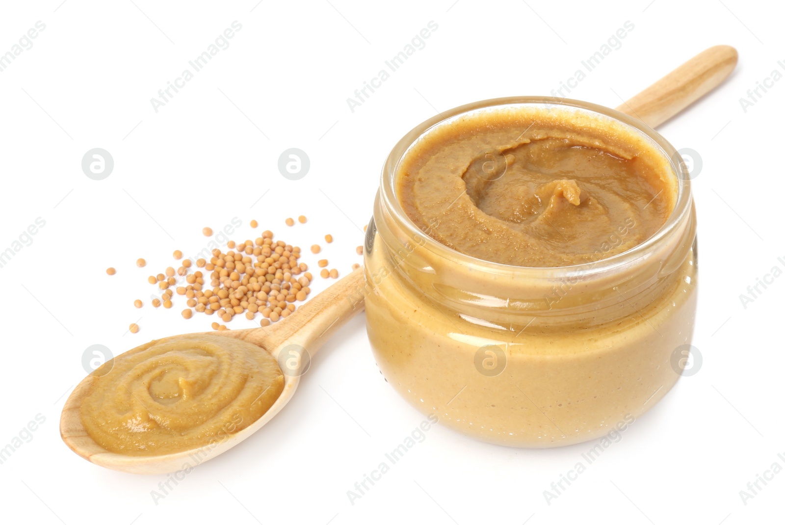 Photo of Fresh tasty mustard sauce in jar, spoon and dry seeds isolated on white