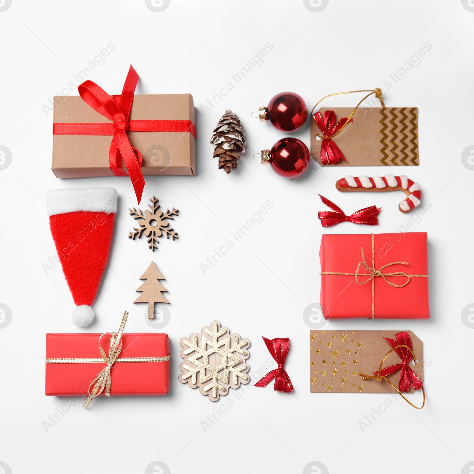 Photo of Frame made with Christmas decor on white background, top view. Space for text