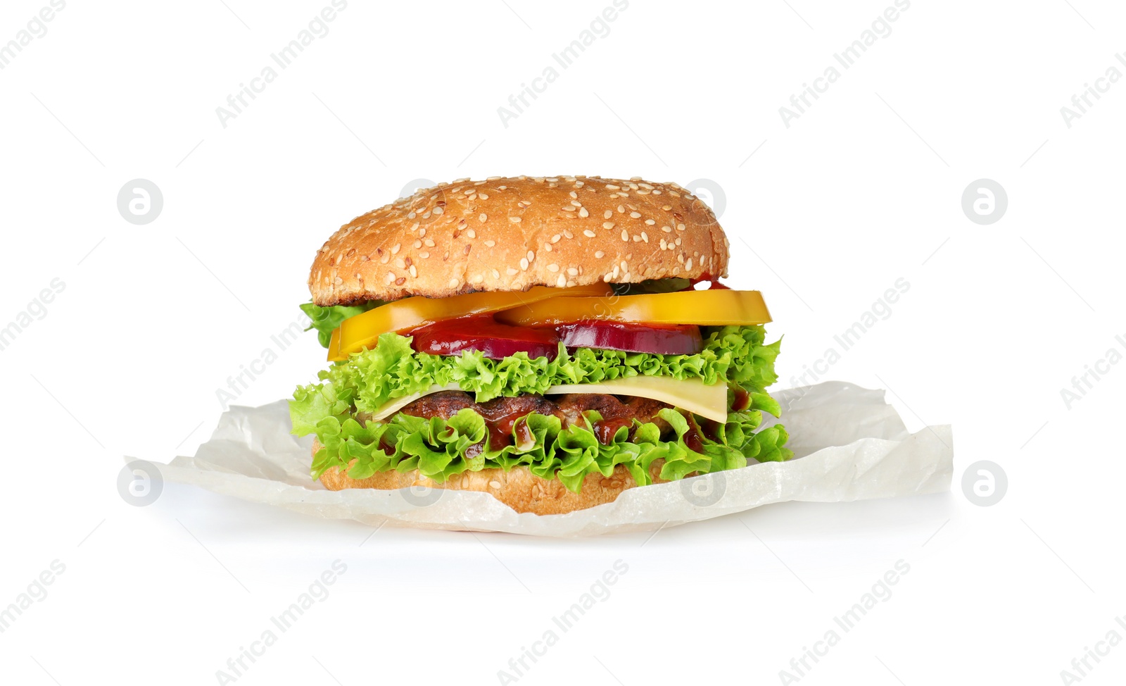 Photo of Parchment with tasty fresh burger isolated on white