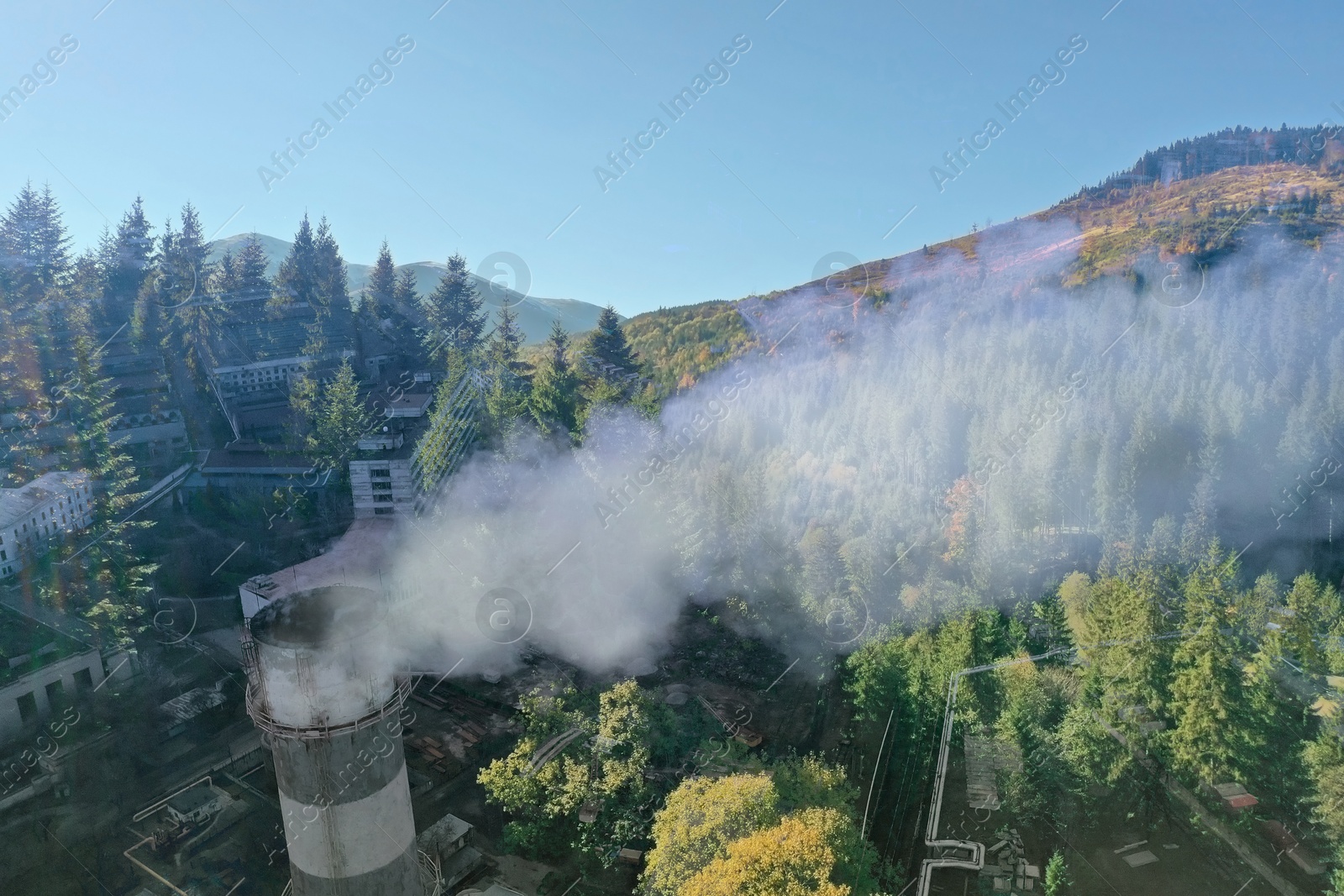 Image of Environmental pollution. Mountain landscape and industrial factory with emissions, double exposure