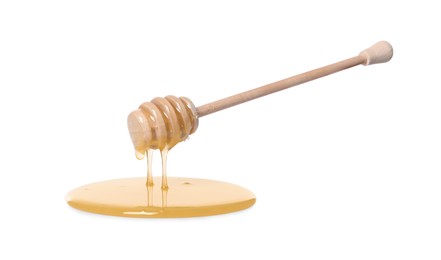 Natural honey dripping from dipper on white background