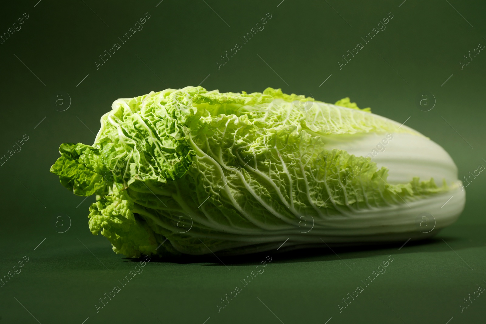 Photo of Fresh ripe Chinese cabbage on green background