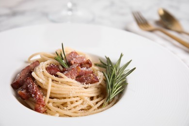 Photo of Delicious Carbonara pasta in plate, closeup view