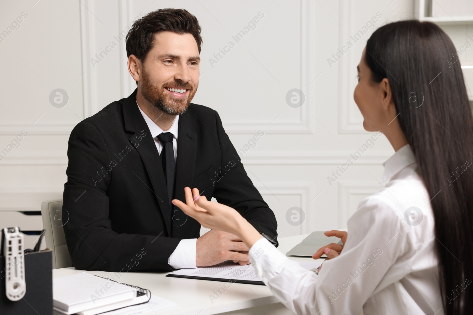 Photo of Human resources manager conducting job interview with applicant in office