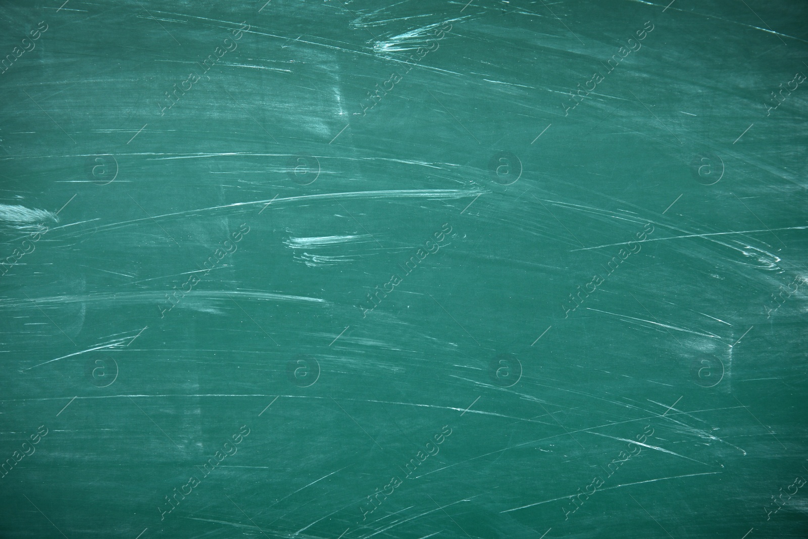 Photo of Dirty green chalkboard as background. Space for text