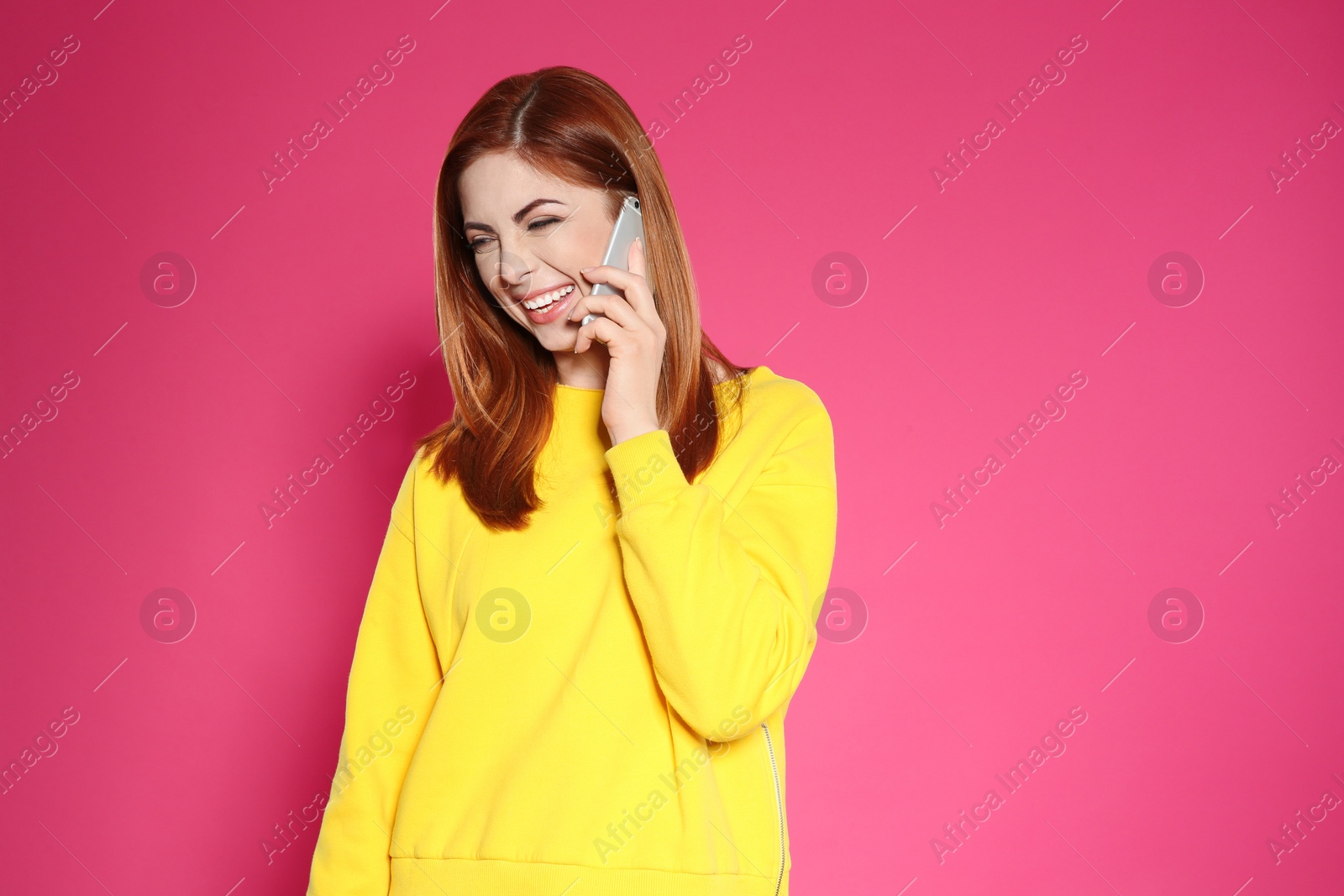Photo of Portrait of beautiful woman talking on phone against color background. Space for text