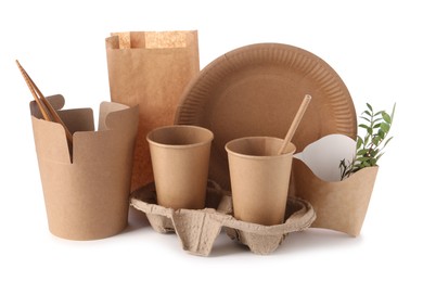 Eco friendly food packagings, tableware, paper bag and twigs isolated on white