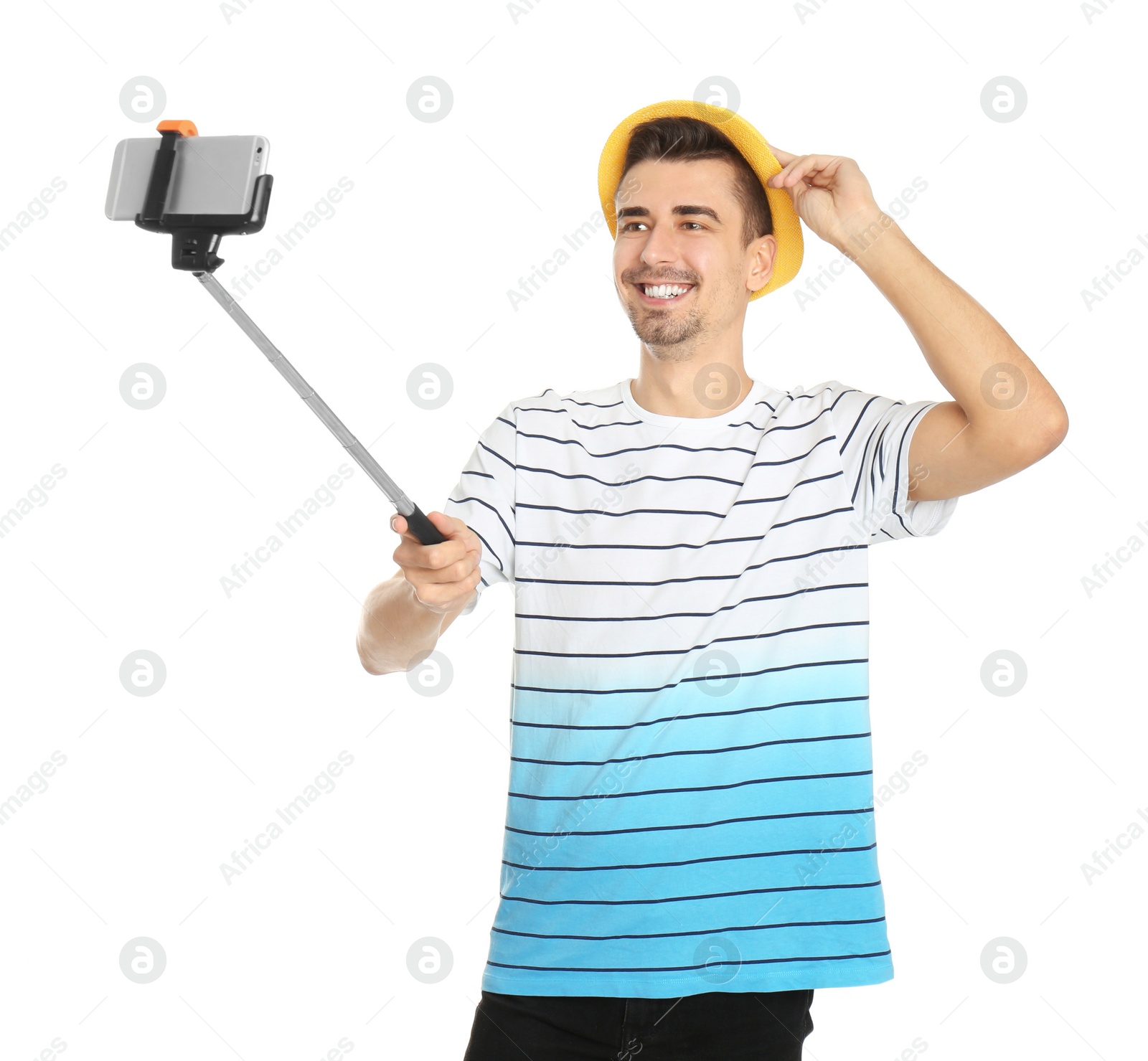 Photo of Young handsome man taking selfie against white background