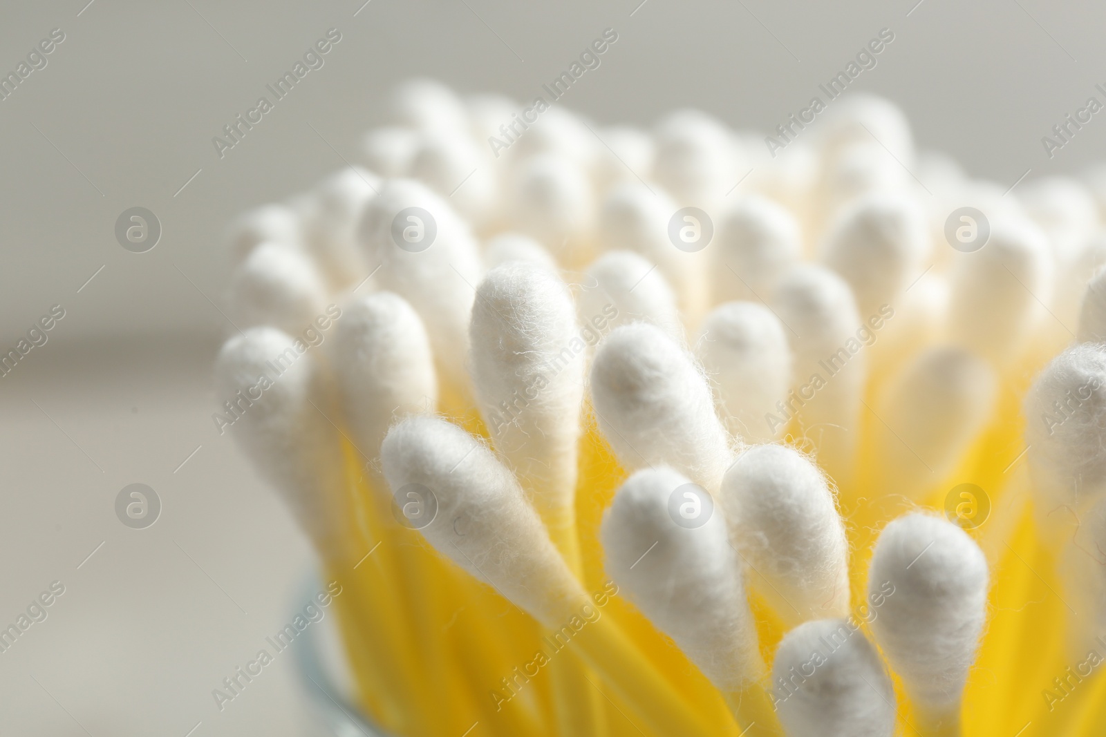 Photo of Cotton swabs on grey background, closeup view