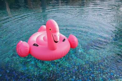 Float in shape of flamingo in swimming pool outdoors