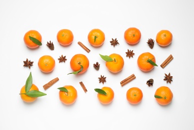 Christmas composition with tangerines on white background, flat lay