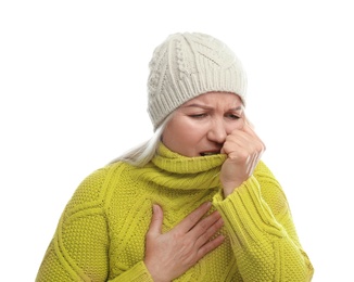 Mature woman suffering from cold on white background