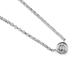 Elegant silver necklace with gemstone isolated on white, top view. Luxury jewelry