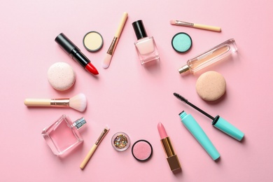 Photo of Flat lay composition with decorative cosmetics on color background