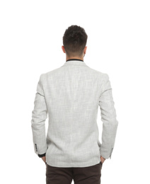 Young professional businessman in suit on white background, back view