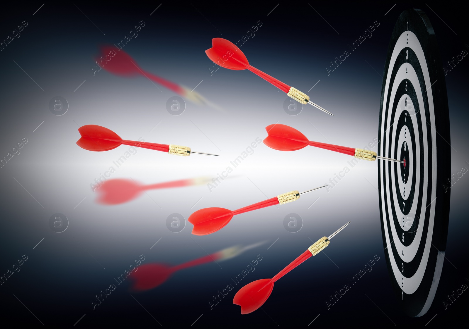 Image of Board and red darts on dark background