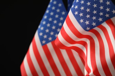 Photo of American flag on black background, closeup. Memorial Day