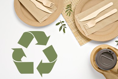 Image of Flat lay composition of eco friendly products and recycling symbol on white background