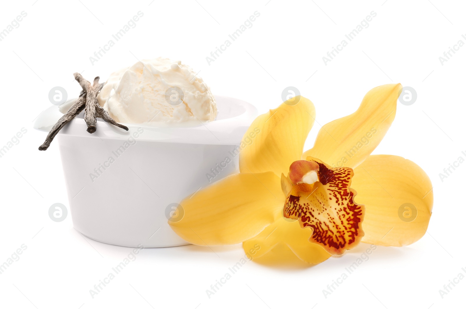 Photo of Bowl with delicious vanilla ice cream, pods and flower on white background