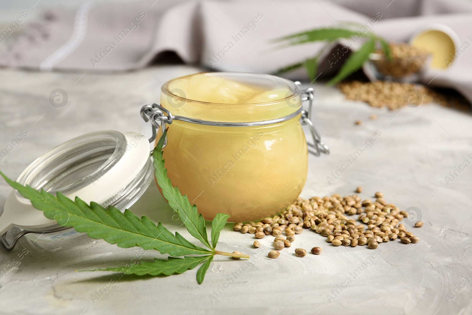 Photo of Composition with hemp lotion on grey background
