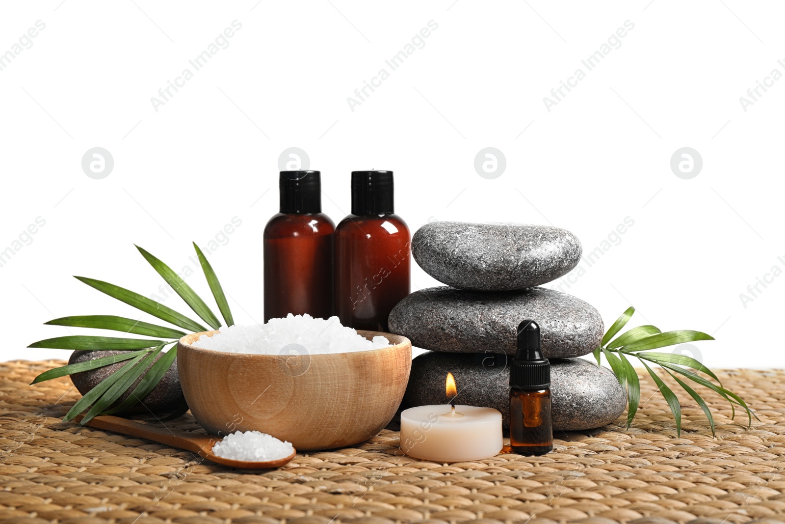 Photo of Beautiful spa composition with bath salt on wicker mat