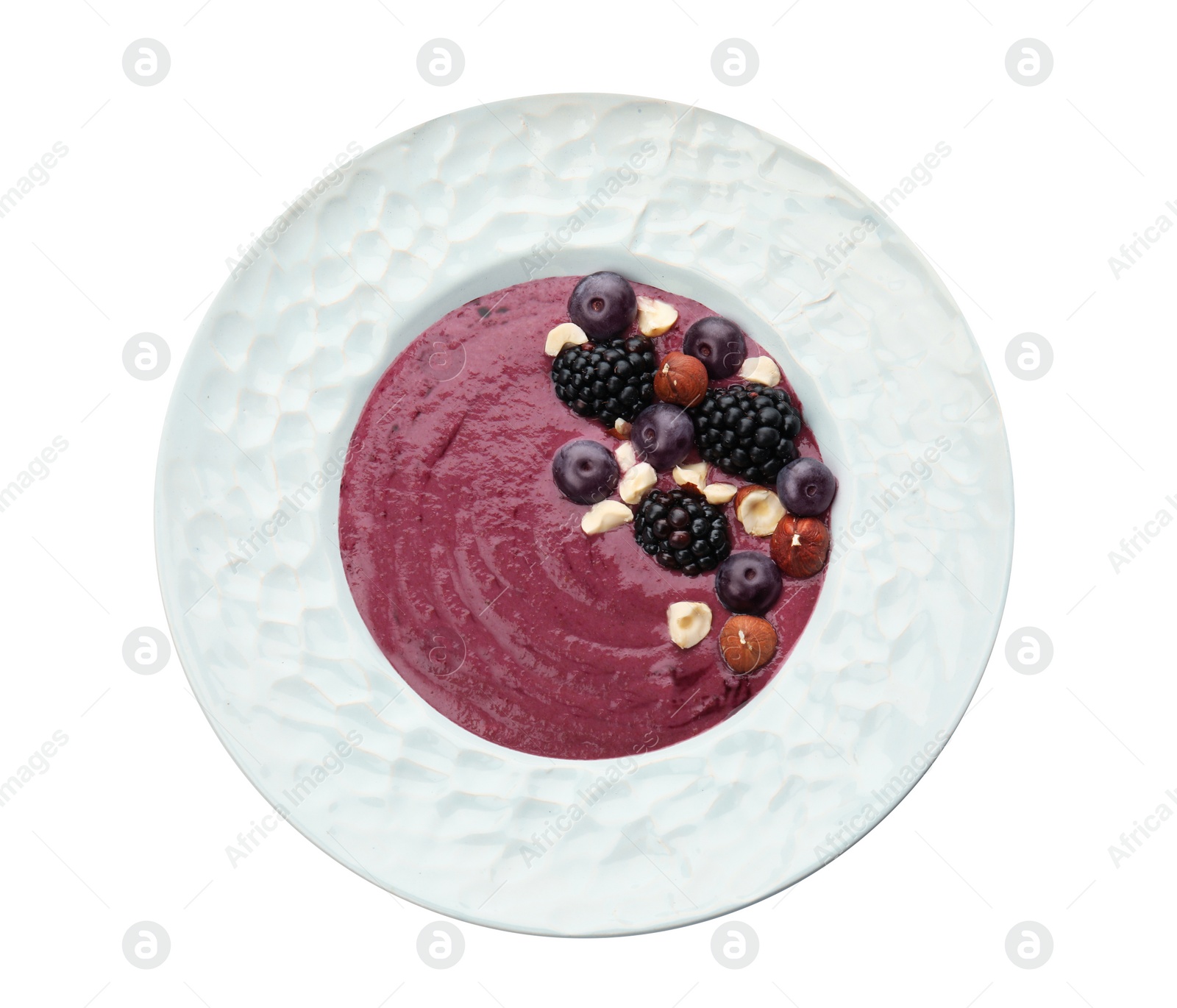 Photo of Plate with tasty acai smoothie on white background, top view