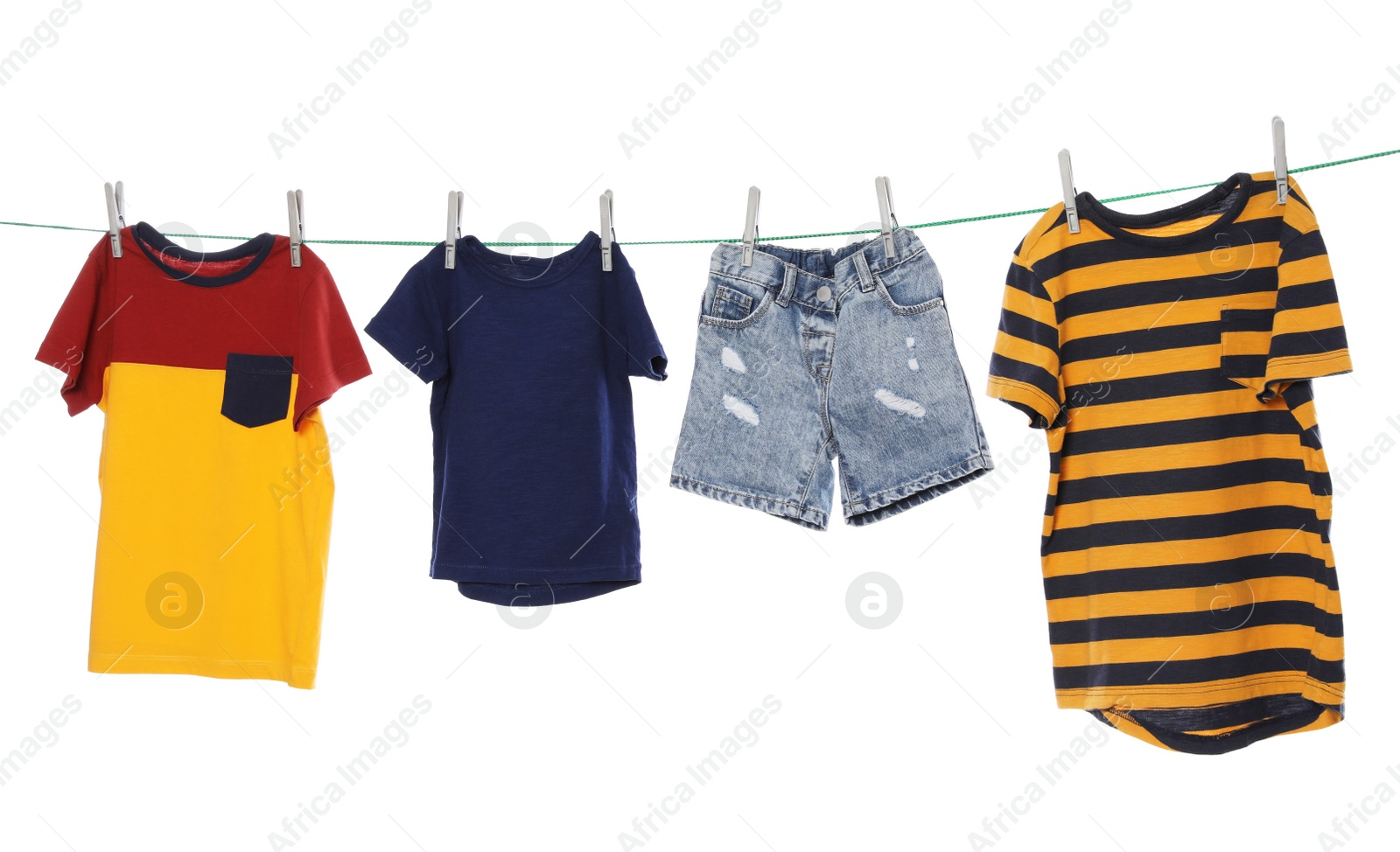 Photo of Different clothes drying on washing line against white background