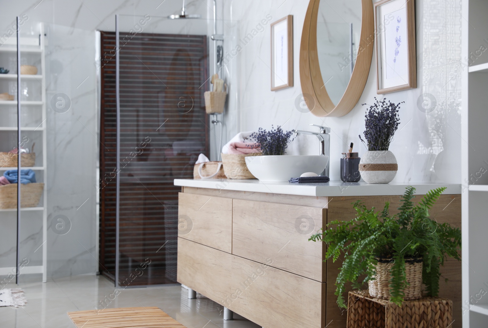 Photo of Bathroom interior with shower stall and counter. Idea for design