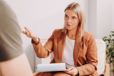 Psychologist working with military officer in office