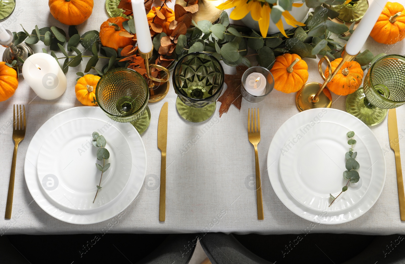 Photo of Beautiful autumn table setting. Plates, cutlery, glasses, pumpkins and floral decor, flat lay