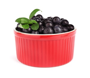 Photo of Bowl with fresh acai berries on white background