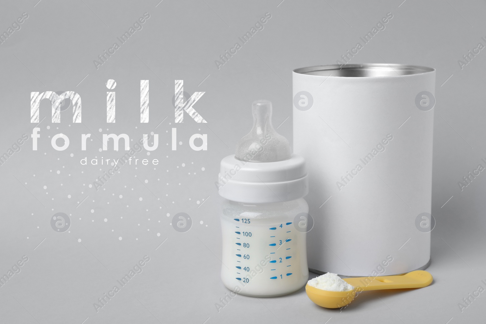 Image of Blank can of powdered dairy free infant formula with scoop and feeding bottle on light grey background. Baby milk