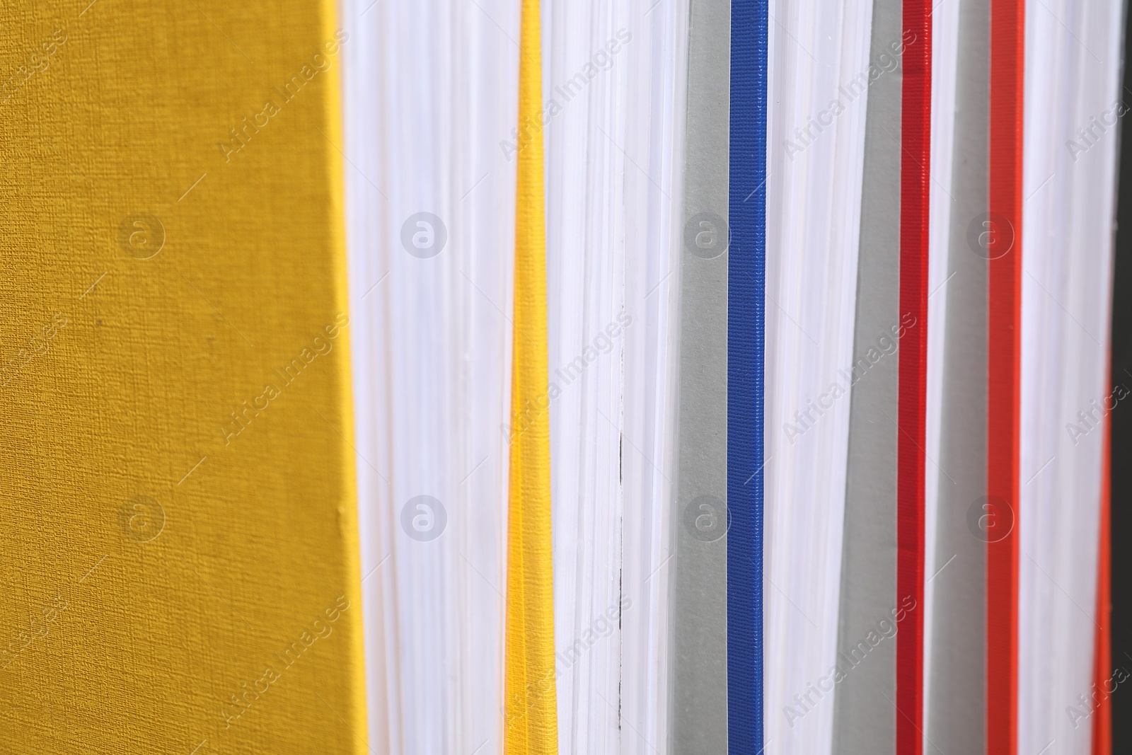 Photo of Colorful binder office folders as background, closeup