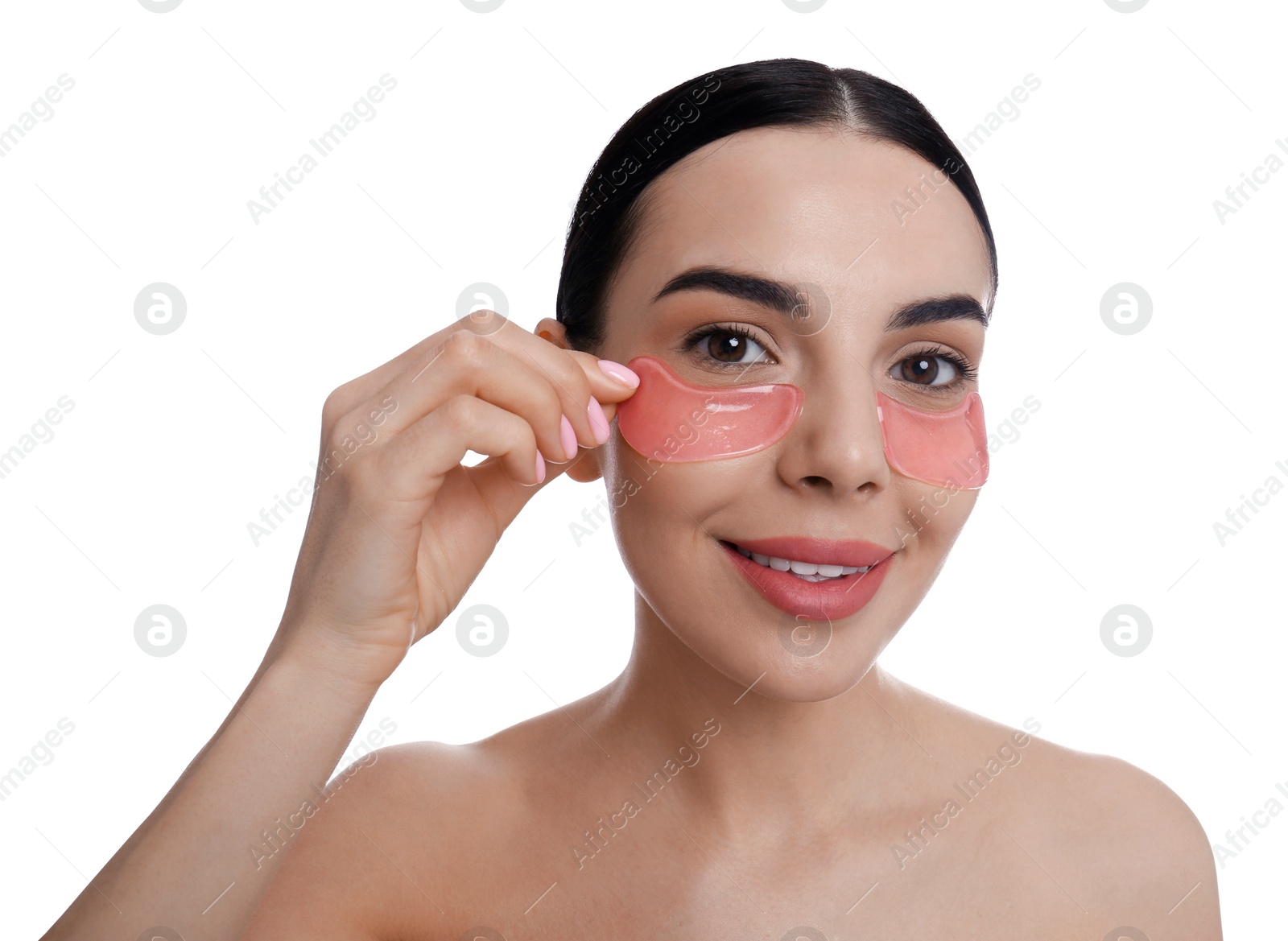 Photo of Beautiful young woman with under eye patches on white background