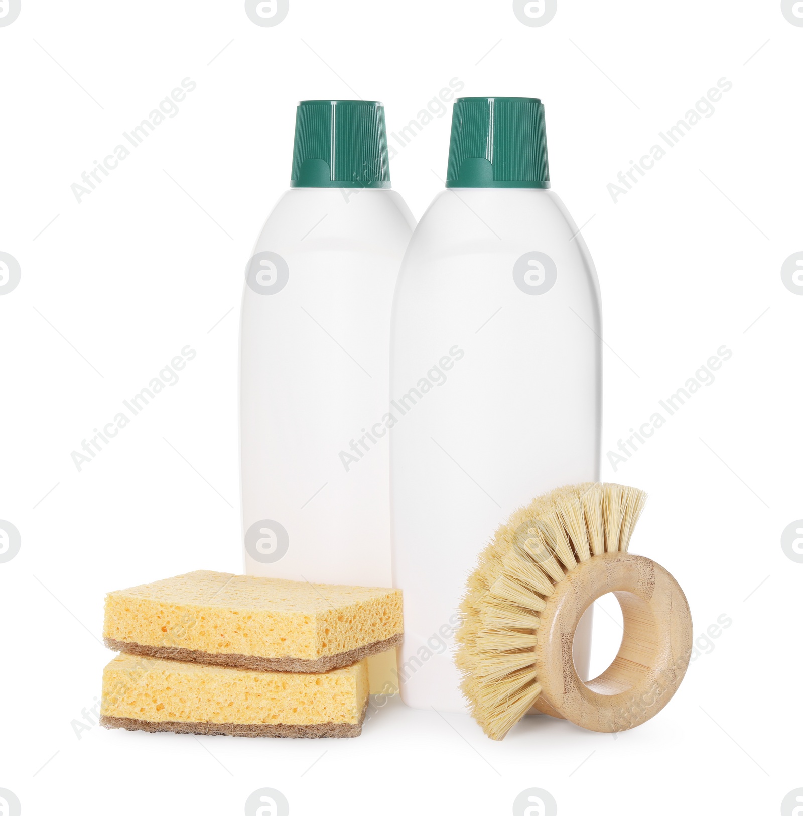 Photo of Bottles of cleaning product, sponges and brush isolated on white